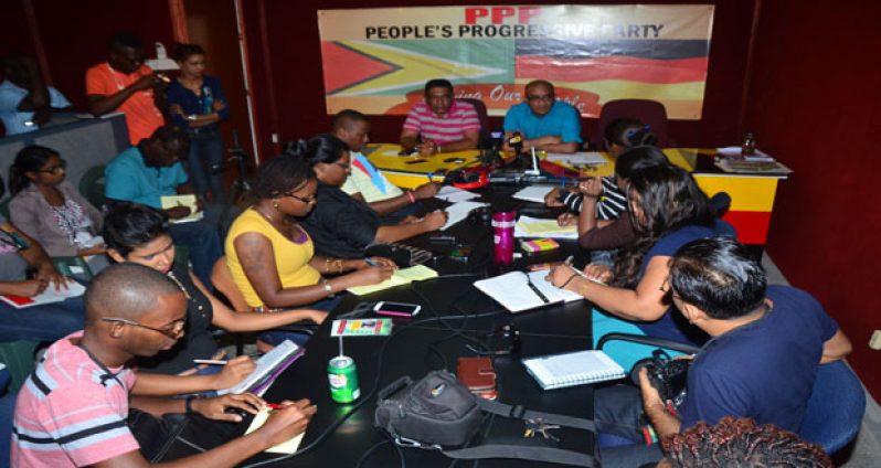 From left, PPP Executive Secretary Zulfikar Mustapha with former president Dr Bharrat Jagdeo addressing several issues with members of the local media corps (Adrian Narine photo)