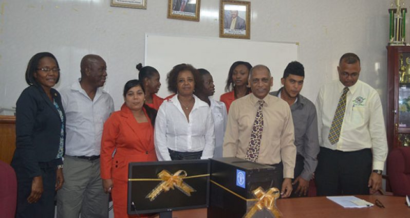Ms. Khadija Musa and Minister Dr. Leslie Ramsammy (both centre) along with other officials, display one of the donations