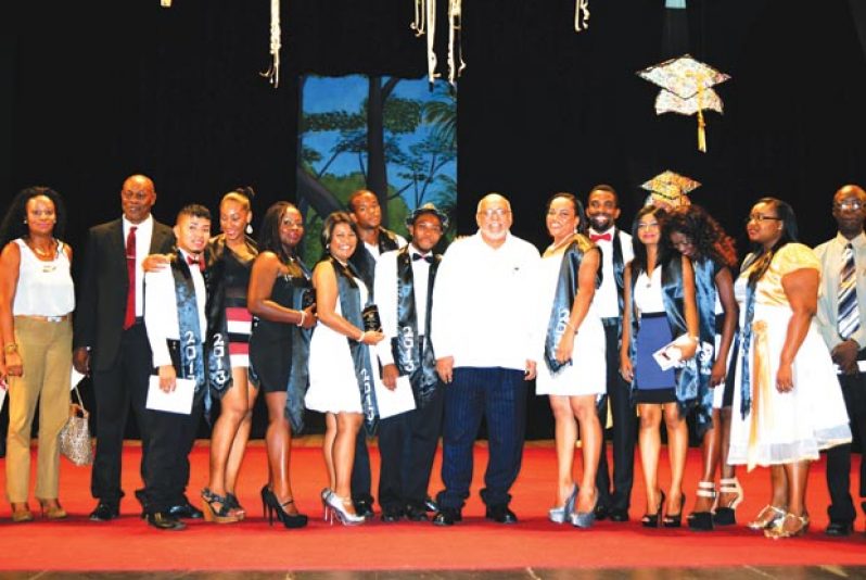 President Donald Ramotar poses with the first batch of graduates of the National School of Theatre Arts and Drama at the National Cultural Centre.