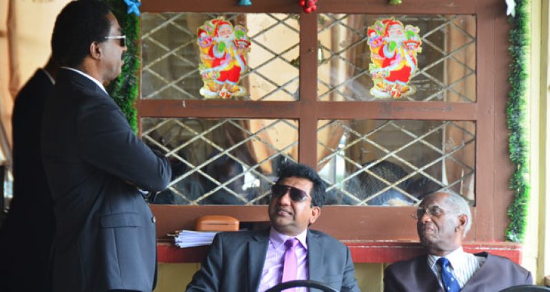 Attorney-at-Law, Basil Williams, at left, in conversation with Attorney General and Minister of Legal Affairs, Anil Nandlall, and Senior Counsel, Ashton Chase in the High Court yesterday
