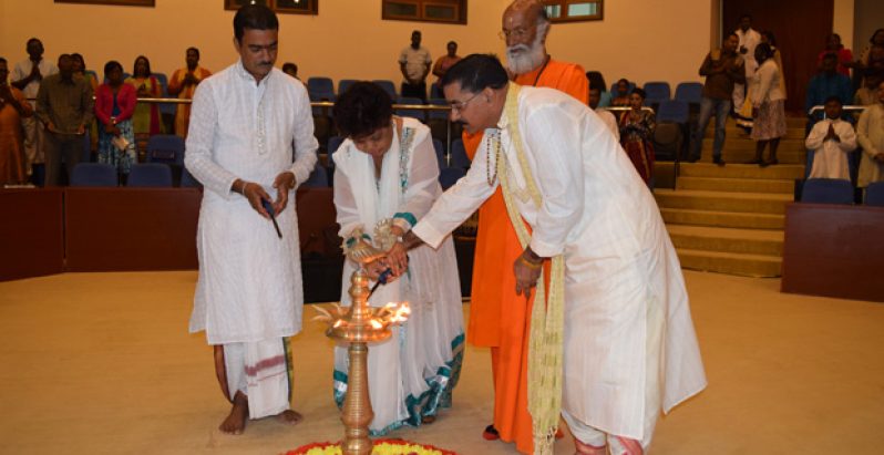 The Viraat Sabhaa, which has the backing of the country’s most respected Hindu leaders, was officially launched on Saturday evening. In photo, Minister of Social Cohesion, Amna Ally, joins Pandit Haresh Tiwari (left); Swaami Kaivalyananda Saraswati; and President of the Sabhaa, Pandit Rabindranath Persaud, to light the ceremonial lamp to begin the proceedings (Cullen Bess-Nelson photo)