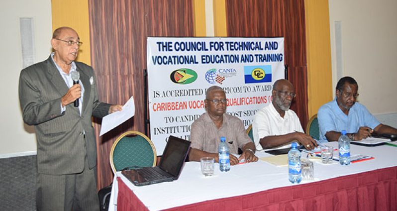 TVET Consultant Mr. John Seeram presenting the TVET Draft Financing Strategy to the Stakeholders’ Consultation Meeting at the Guyana Pegasus on Wednesday. Seated from left are: Senior TVET Officer Mr. Jerry  Simpson; Technical Facilitator Mr. Vincent Alexander; and Chairman Dr. Leyland Thompson, of the Faculty of Education and Humanities, University of Guyana