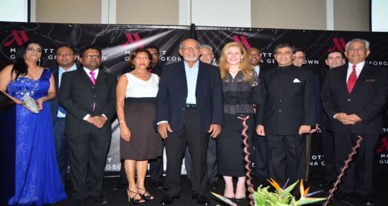 President Donald Ramotar, First Lady Deolatchmee Ramotar, Ms Brenda Durham – Senior VP for Marriott International, Finance Minister Dr Ashni Singh, Tourism Minister Irfaan Ali, Mr Winston Brassington – Chairman of NICIL and Atlantic Hotels Inc; Ms Marcia Nadir-Sharma – Deputy CEO of NICIL;  Mr Roberto Grissi - General Manager of the Guyana Marriott Hotel, and other officials on stage at last Thursday evening’s gala reception at the newly opened Marriott Hotel in Kingston, Georgetown (Adrian Narine photo)