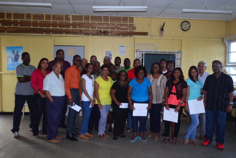 Senior staff and board members pose with award winning employees at the Chronicle Sports Club last Friday.
Second from left are: Mrs. Moshamie Ramotar, Finance Controller; third from left is (Board Member) Mr. David De Groot; Second from left in back row is Mark Ramotar, Editor; third from left in back row is Mr. Tota Mangar (Board Member); at extreme right is Managing Director Mr Nand Puran, and second from right (in back row) is Mr Chamanlall Naipaul, Assistant Editor (Photo by Adrian Narine)