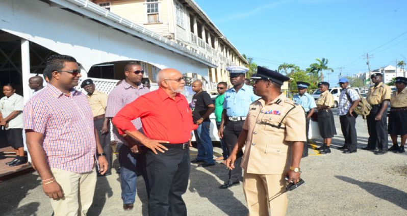 Assistant Police Commissioner Clifton Hicken briefing the Commander-in-Chief on the security arrangements on the ground yesterday morning