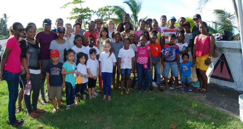 A group of children with CCPA Director Ann Greene, UNICEF representative Marianne Flach and SASOD’s Secretary, Board of Trustees, Zenita Nicholson.