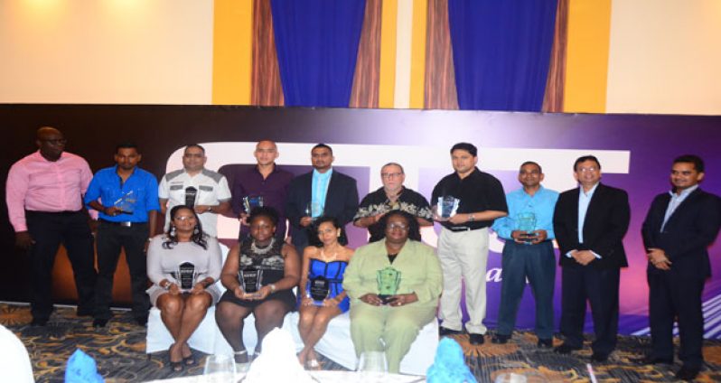 CEO of GT&T, Radha Krishna Sharma (second right) and MMG’s Managing Director, Ishwar Thakurdin (right) striking a pose with the awardees at the ceremony last week