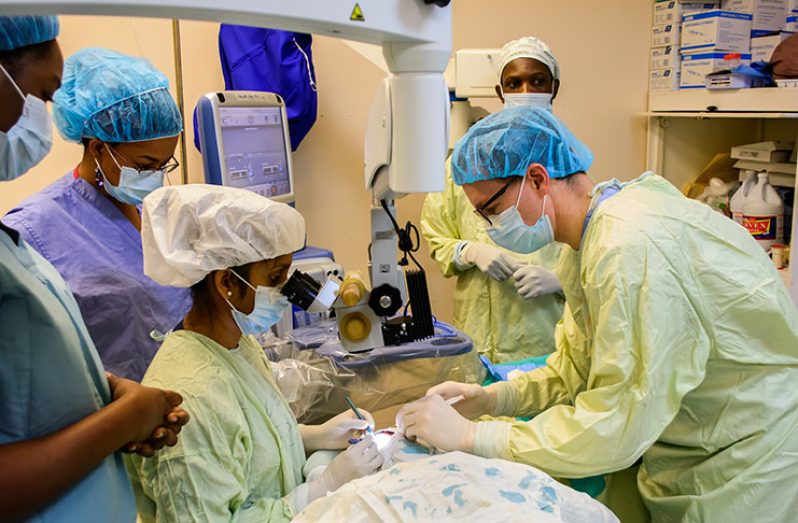 US Ophthalmologist, Dr. Aaron Smalley (right) and team of doctors during a cataract surgery at the GPHC – all part of the Ophthalmologist training in cataract surgery