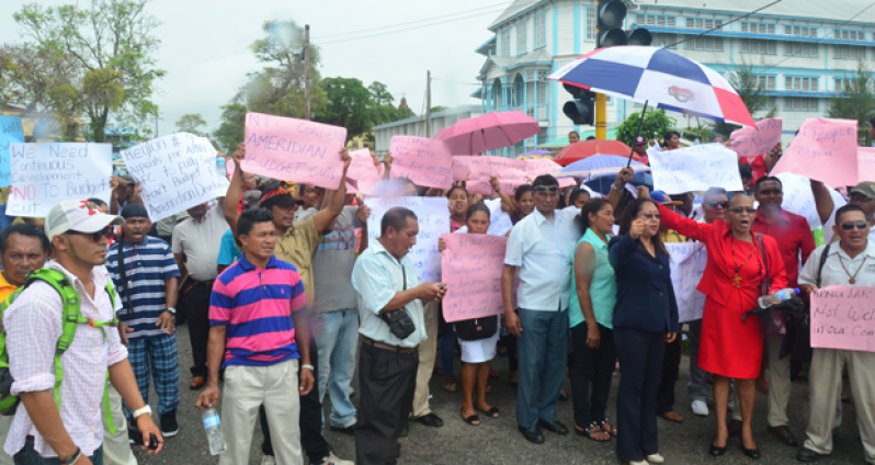 ‘WE DEMAND WHAT IS OURS’: Amerindian Affairs Minister, Pauline Sukhai, stands with hundreds of Amerindians protesting the combined Opposition’s disapproval of budgetary allocations to advance their development. (Adrian Narine photo)