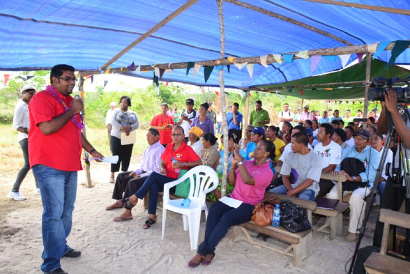 Minister of Housing and Water , Irfaan Ali addressing the gathering yesterday during the LIS programme commissioning ceremony at Kwatamang in Region 9 (Adrian Narine photo)