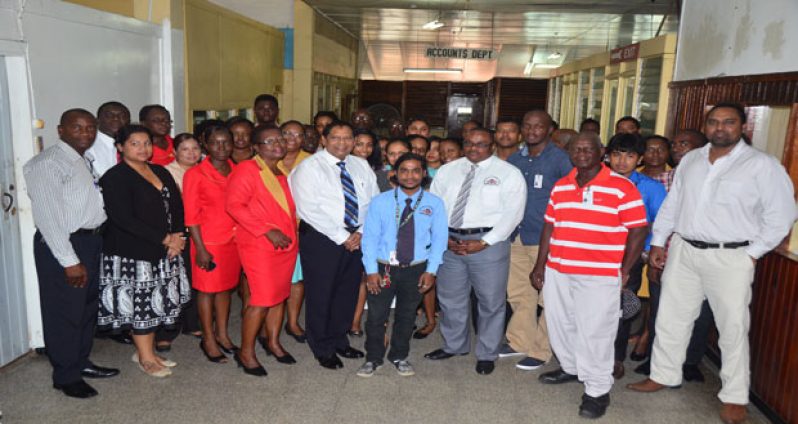 Prime Minister Moses Nagamootoo, centre, with GNNL staffers