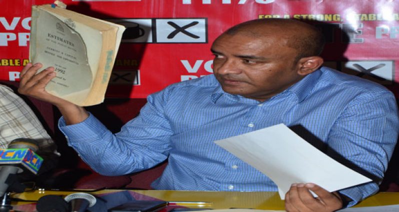 Former president, Dr Bharrat Jagdeo, produces a copy of the 1992 budget detailing the monies appropriated for the armed services(Adrian Narine photo)