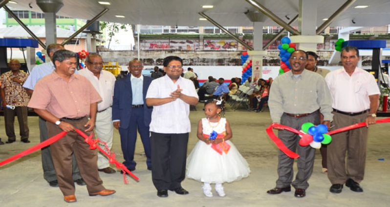 Finance Minister, Dr. Ashni Singh, and GuyOil officials during the ceremonial ribbon-cutting for the commissioning of the Company’s Regent Street Service Station (Photo by Adrian Narine)
