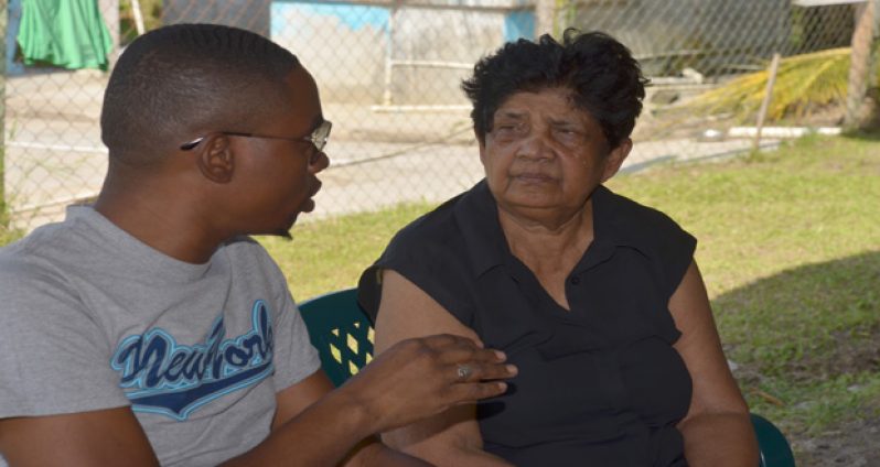 Mrs. Sylvia Persaud speaking with Chronicle’s crime reporter Leroy Smith yesterday, when she expressed how heartbroken she was to learn that her daughter-in-law had hired a hitman to kill her eldest son.