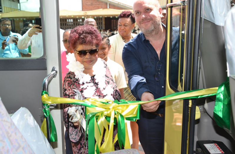 Minister of Social Protection, Amna Ally and Casino Manager at Princess Ramada Hotel, Eray Kanmaz cuts the ribbon to commission the David ‘G’ School Bus