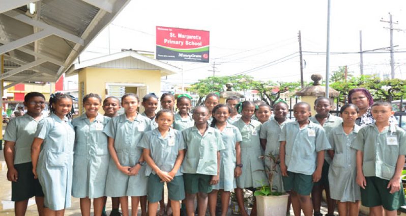 St. Margaret’s top achievers pose with their teacher, Mrs Kathryn Persico-Newton, at right