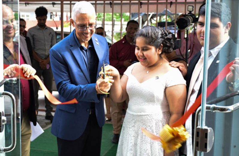 Minister of Business, Dominic Gaskin, cutting the ribbon