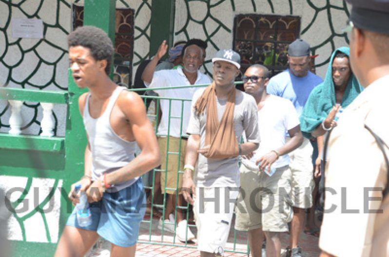 Inmates following the meeting with government ministers. [Delano Williams Photo]