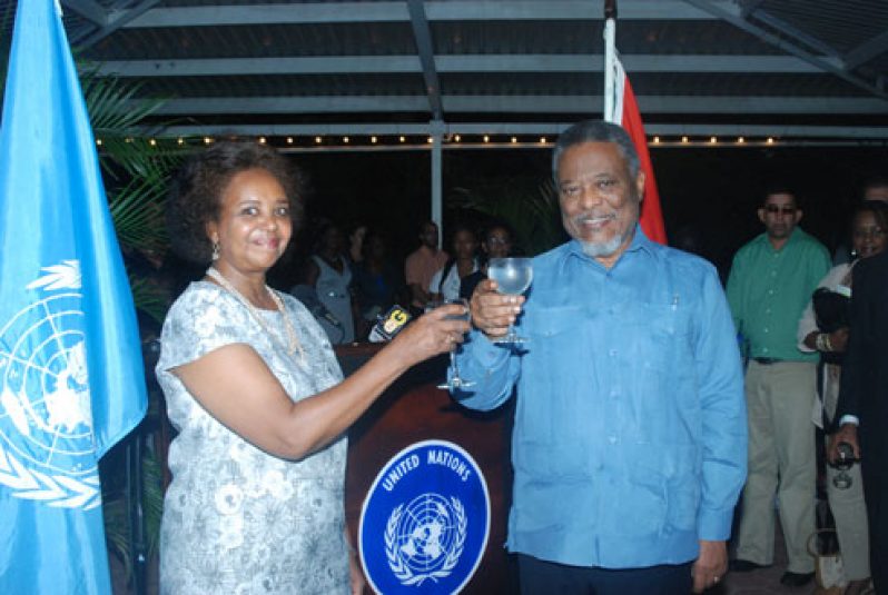 Resident UN Coordinator, Ms Khadija Musa and Prime Minister Samuel Hinds toast to the strong partnerships existing between the UN agencies and programmes and the Government of Guyana