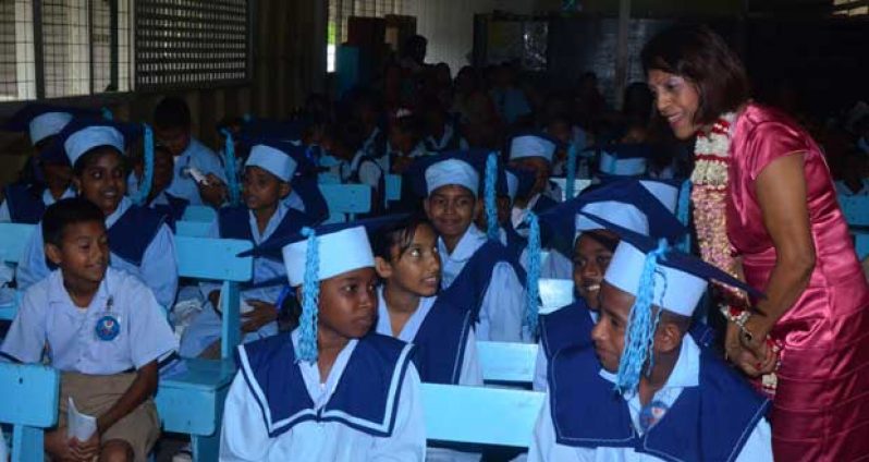 First Lady Deolatchmee Ramotar interacts with the graduating students