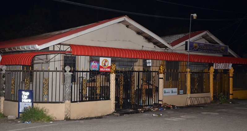 The buildings which house Laleeta’s Wholesale and Retail Grocery Store and the Golden Phoenix Chinese restaurant were damaged by fire late on Saturday night (Delano Williams photo)