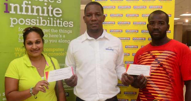 From left, Ms. Romona Urling, Mr. Pernell Cummings Marketing Manager of Courts Guyana Inc., and Quason Boodie