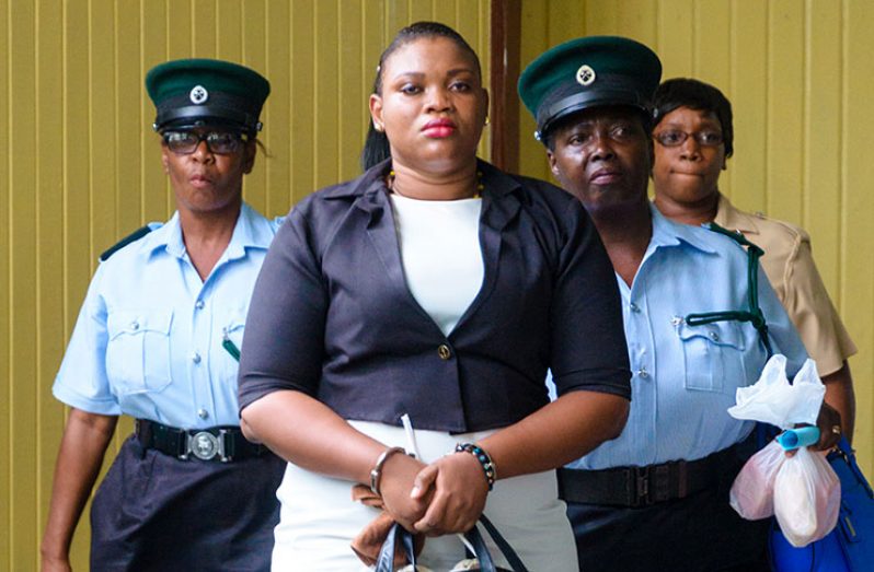 Rutherford as she was being escorted for her sentencing before Justice Navindra Singh in the Georgetown High Court on Monday afternoon.