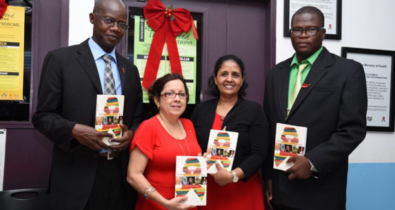 At yesterday’s launch of ‘My HIV Story’ by Rawle Nelson. Displaying copies of the book are (from left): UNAIDS Representative, Dr. Martin Oditt; Dr. Ruth Ramos; Dr. Shanti Singh; and Author, Rawle Nelson