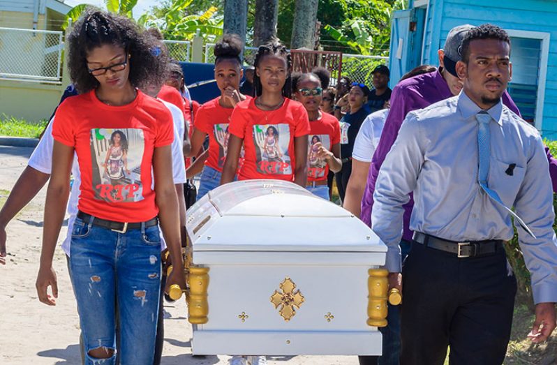 The body of Teacher Kescia Branche being taken into the GTU compound for the Thanksgiving Service (Delano Williams photo)