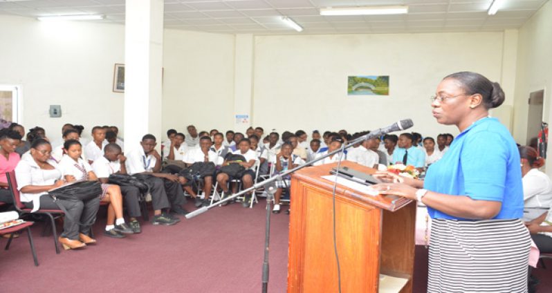 Minister within the Ministry of Education Nicolette Henry addressing the gathering at the symposium on the 2030 Agenda for Sustainable Development