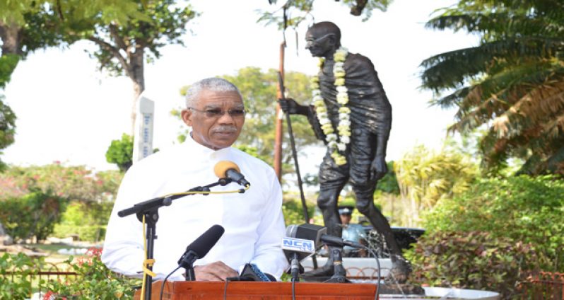 President David Granger addressing the gathering yesterday morning, at the Promenade Gardens on the occasion of Mohandas Gandhi's 146th birth anniversary