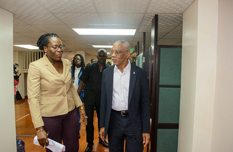 President David Granger interacts with Ndibi Schwiers, Director of the Department of Environment, during a tour of the department after it was officially commissioned on Wednesday