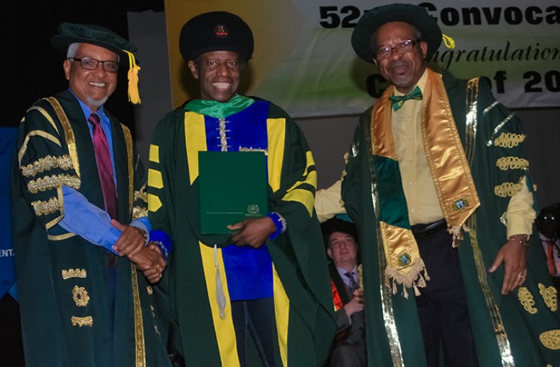Mr Eddy Grant being conferred with his Honorary Doctorate Degree (Photo by Delano Williams)