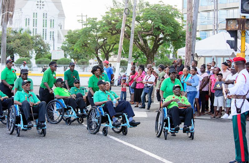 Some Guyana Legion veterans being taken in wheelchairs to the Remembrance Day Ceremony held at the Cenotaph on Sunday