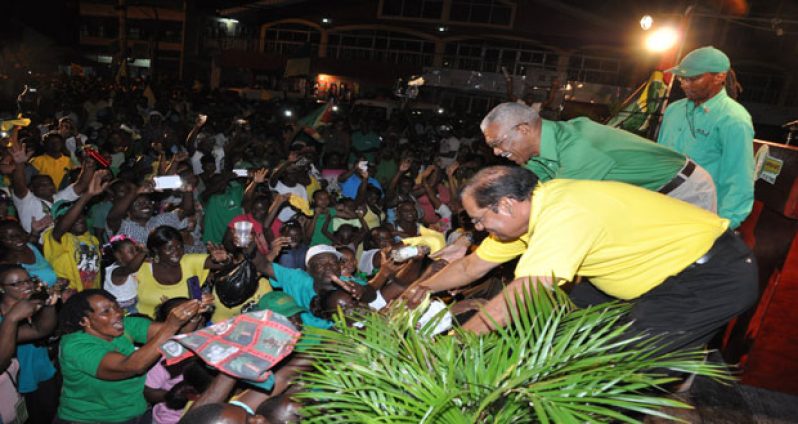 : APNU+AFC Presidential and Prime Ministerial Candidates Brigadier (rtd) David Granger and Moses Nagamootoo greet supporters