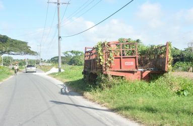 ‘EYE SORE’: The abandoned trucks rot at the roadside on Best Village.  (Samuel Maughn photos)