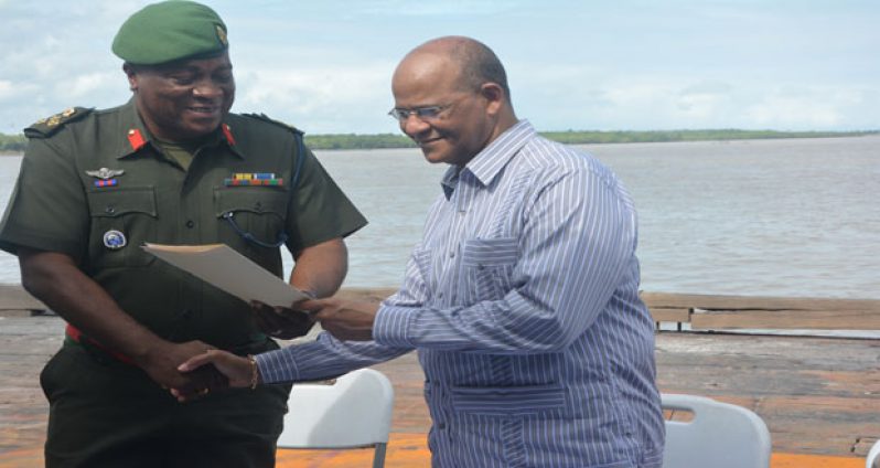 Chief of Staff, Brigadier Mark Phillips as he accepted the signed MOU from Minister Rohee (Photos by Samuel Maughn)