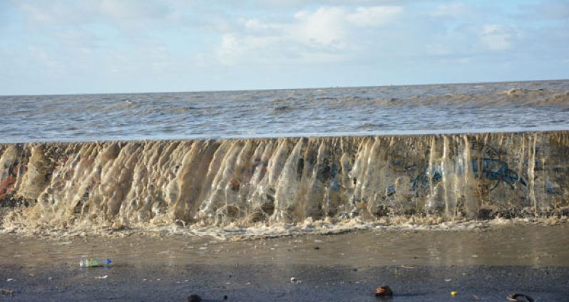 Water breaching the sea defence recently during the hide tide period 9Photo by Samuel Maughn)