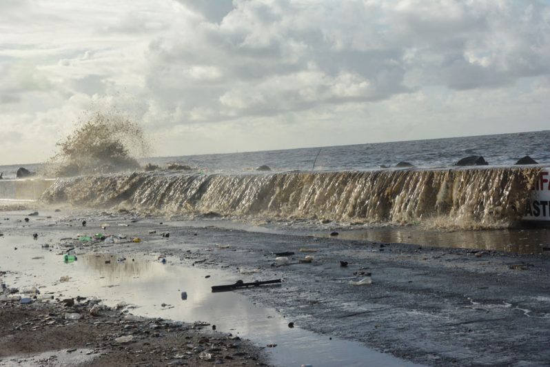 Spring tide continues as water can be seen breaching the sea wall (Samuel Maughn photo)