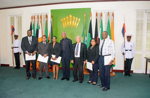 President David Granger with the newly sworn-in commissioners of the Lands Commission