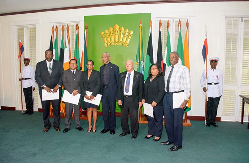 President David Granger with the newly sworn-in commissioners of the Lands Commission