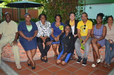 Ms. Thomas (stooping) poses with Georgetown Mayor Patricia Chase-Green and other colleagues at a Councillors’ workshop recently.