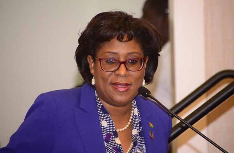 Minister of Public Telecommunications, Ms Catherine Hughes addressing the opening session of the forum