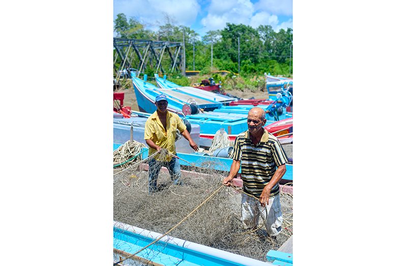 Some of the community’s fishermen preparing to go fishing (Samuel Maughn photos)