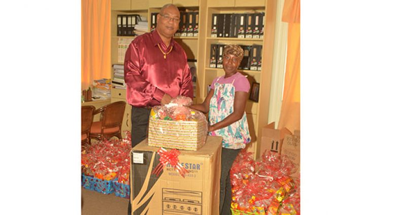 Miss Moses received her stove and Christmas hamper from Minister Edghill yesterday