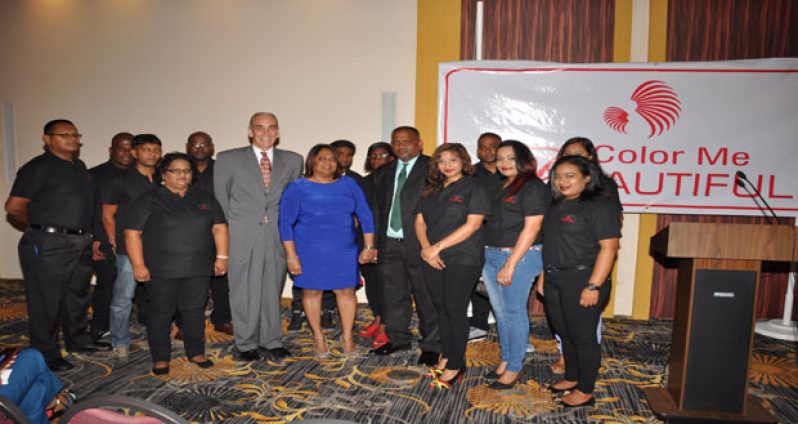 CEO of B & H Systems Guyana, Ann Singh (centre) with Director Daniel Harricharran (right) and CEO of ‘Color Me Beautiful’, Steve DiAntonio, (left) flanked by staffers.