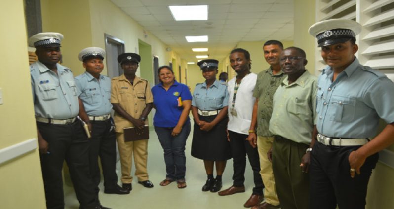 Ranks of the Police Traffic Department and Road Safety officials after touring the GPHC Accident Wards. Third and fourth left are Traffic Chief (Ag) Dennis Stephens, and Co-ordinator of the National Road Safety Council, Mrs. Ramona Doorgen. Second and third right are Victor Graham and Shahab Hack (Photos by Cullen Bess-Nelson)