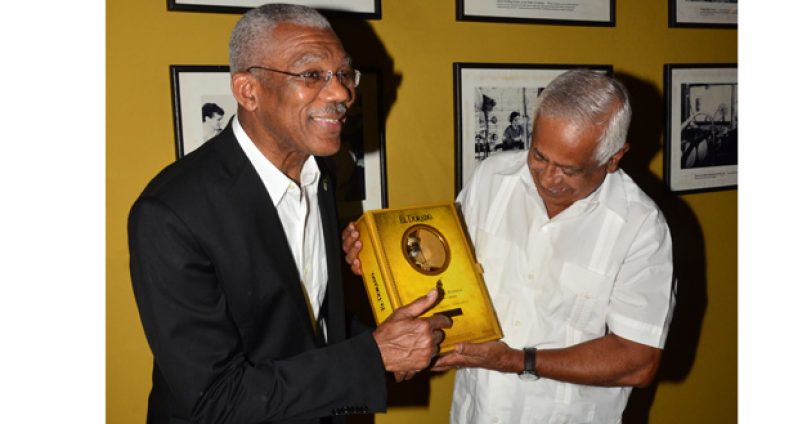 President David Granger and businessman Hemraj Kissoon delight in a bottle of DDL 50-year special reserve, launched to celebrate Guyana’s Golden Jubilee Year of
Independence