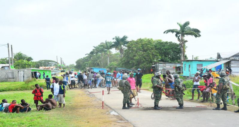 GDF ranks erect and man a military cordon to stand guard
outside the burnt out ‘C’ Field Sophia PPP/C Command Centre