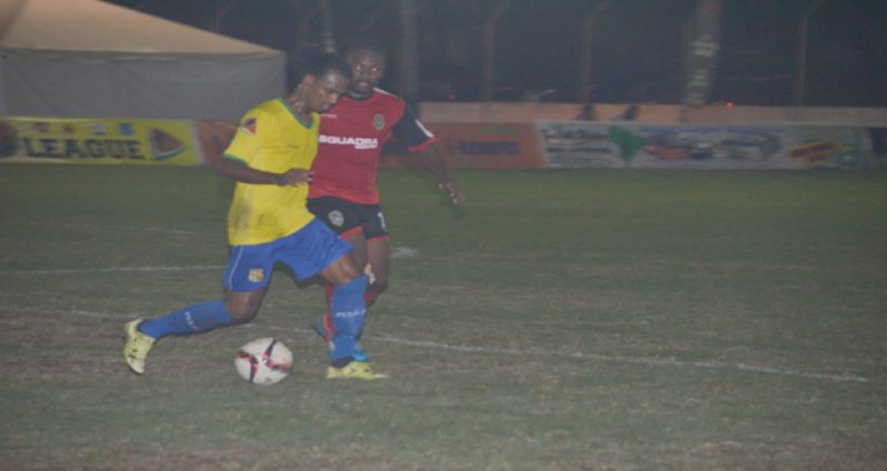 Alpha United’s Philbert Moffat is keeping Gregory Richardson in check